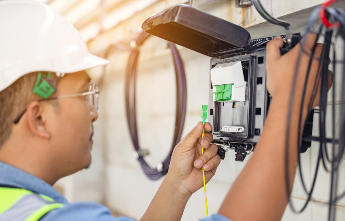 a technician installs a fiber internet line to a home